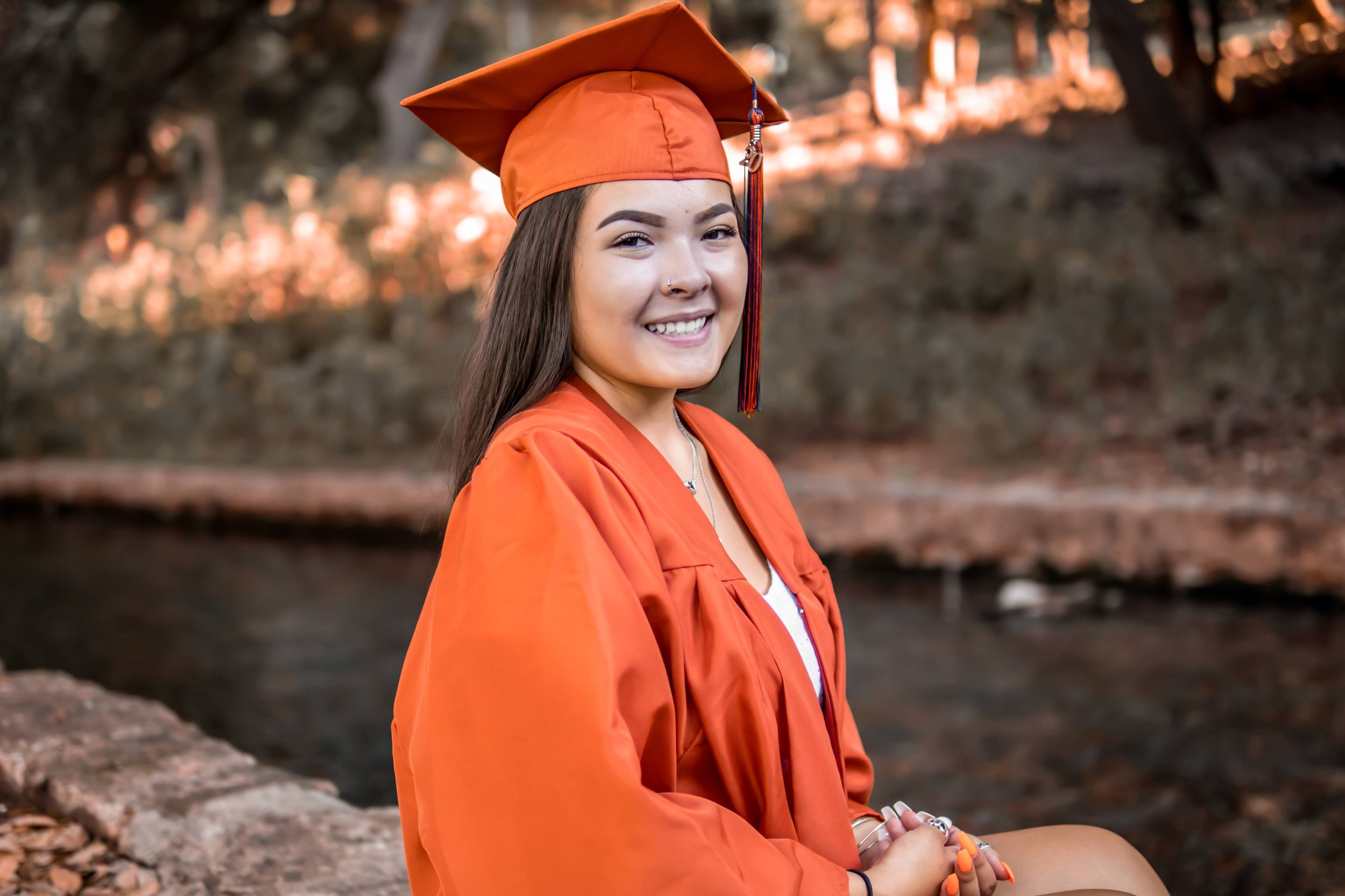 Graduate in an orange gown