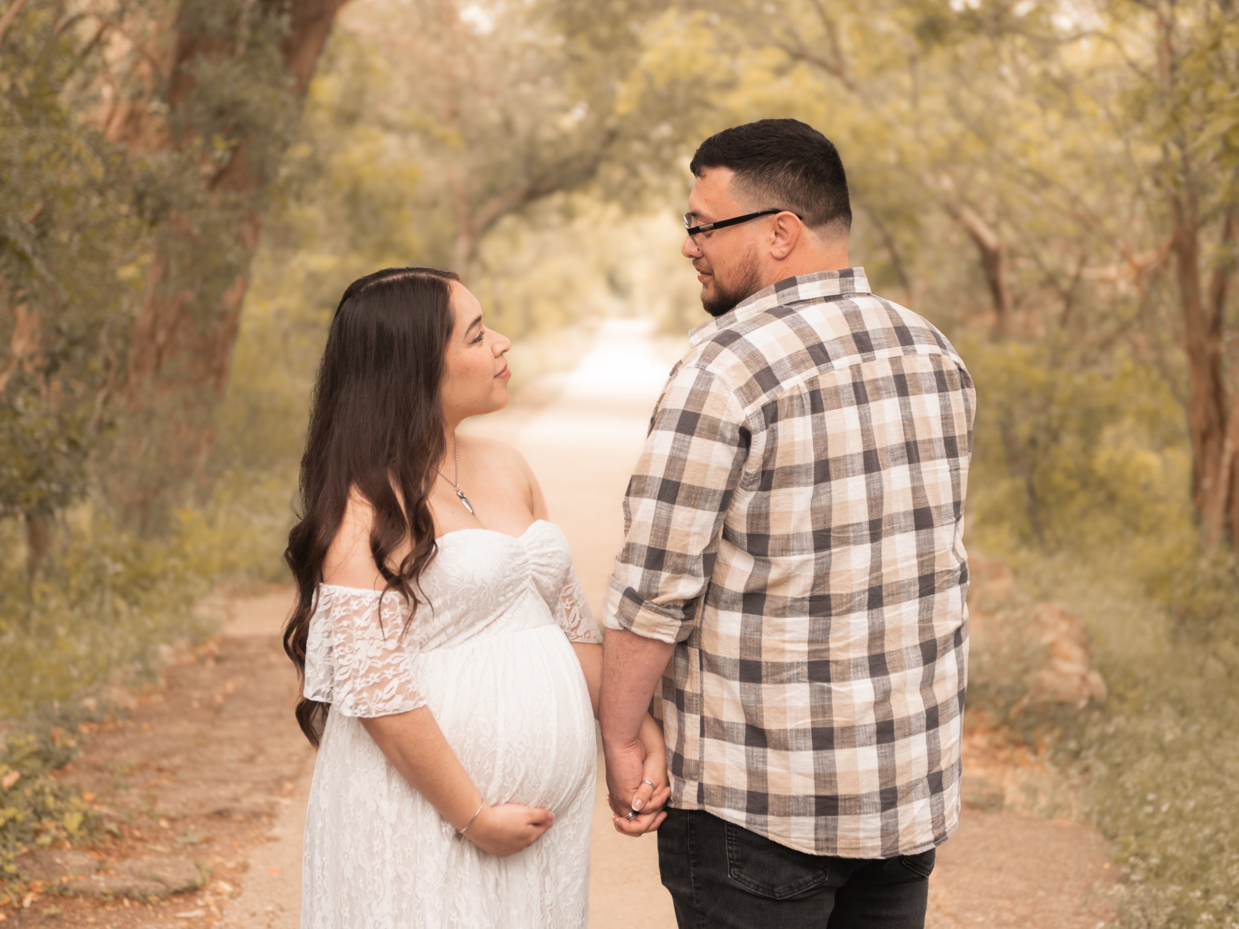 Expecting couple holding hands