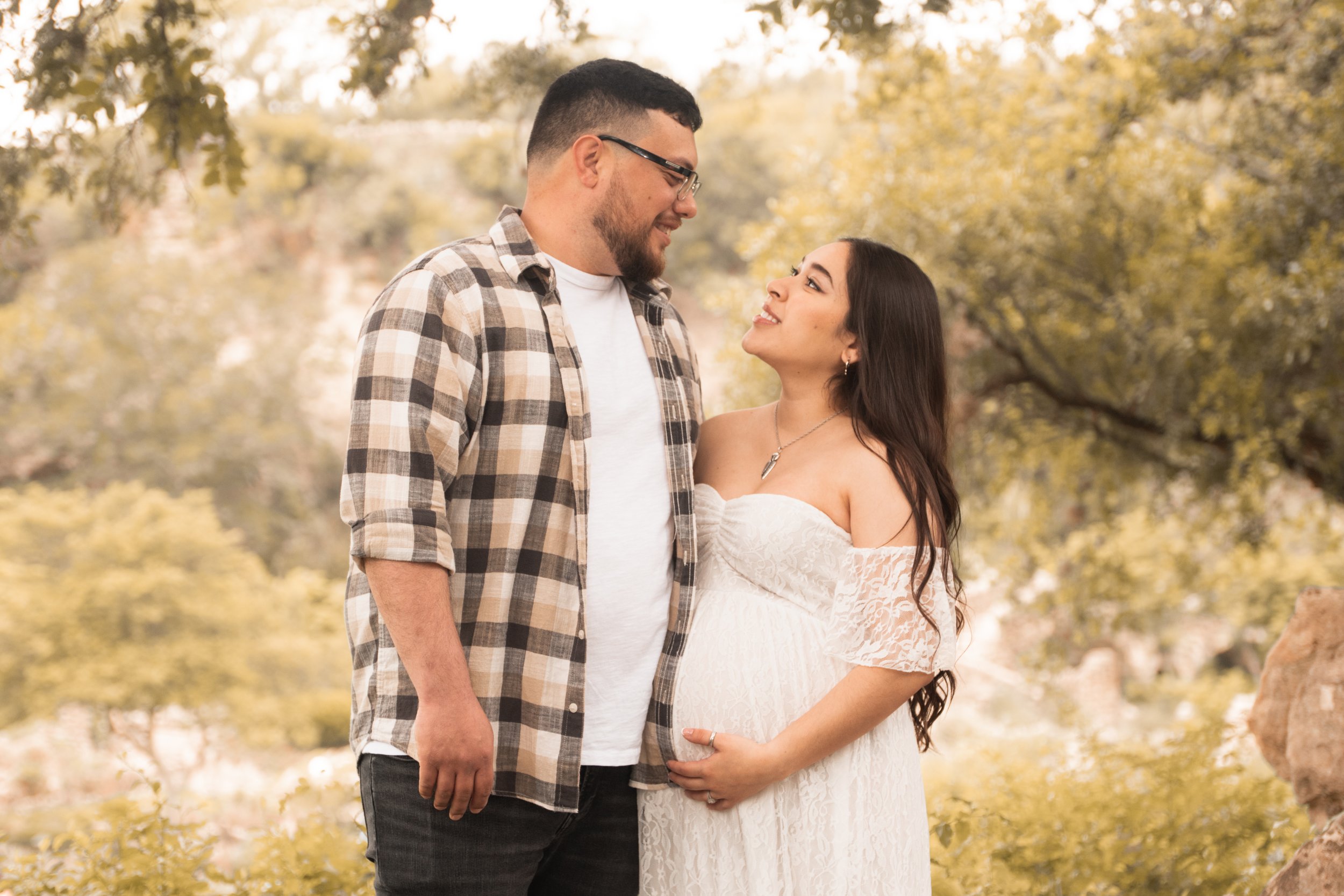 Expecting couple outdoors