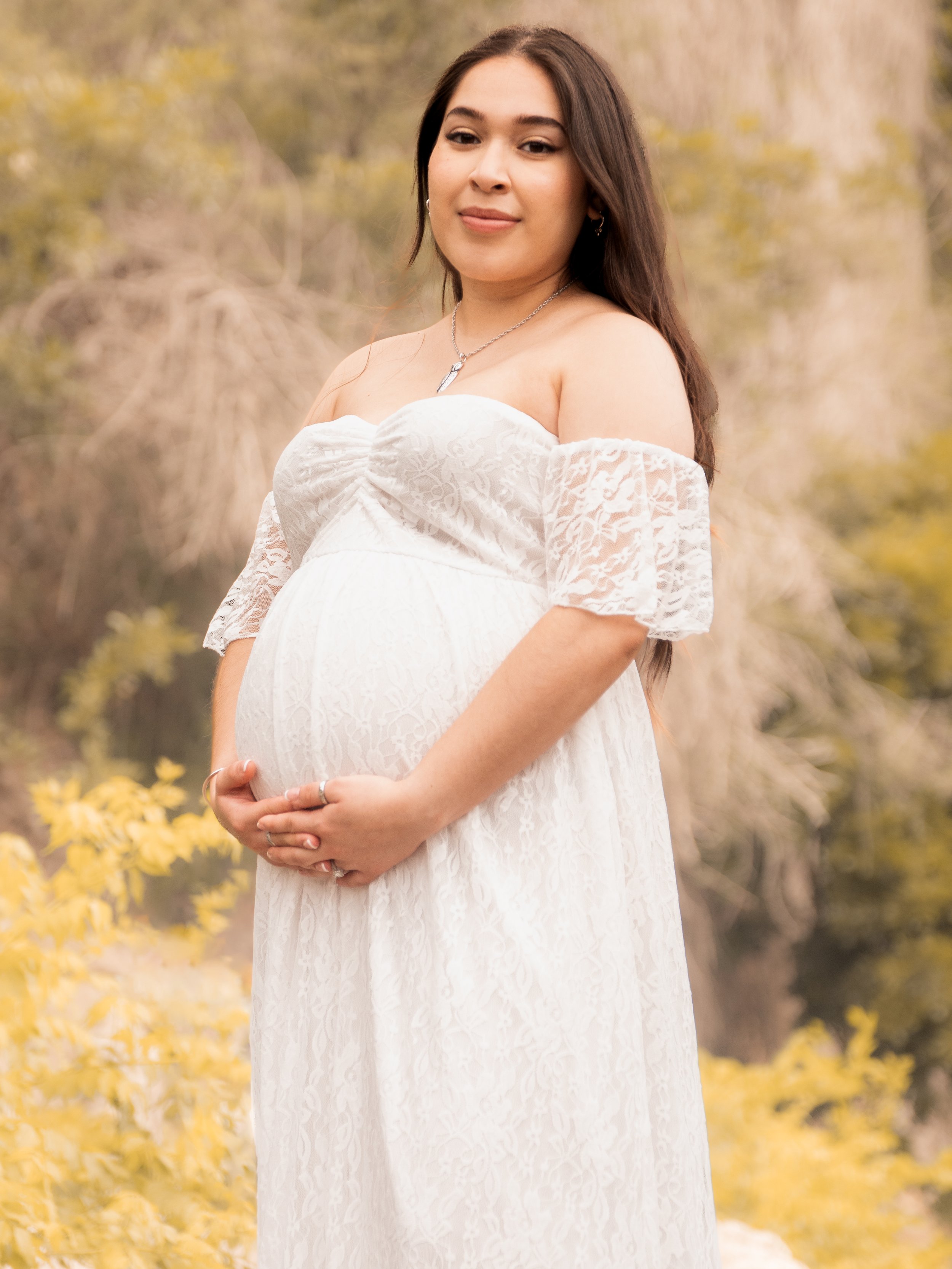 Maternity portrait in a white dress